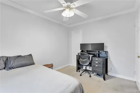 a bedroom with a bed and a chair