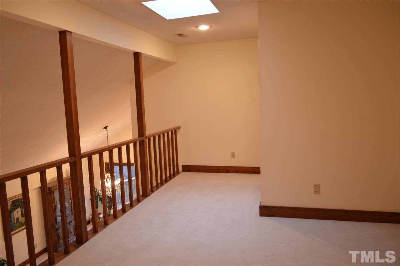 5200 Caber Road Raleigh, NC 27613 - Photo 20 of 25 The loft has a skylight and a view of the formal living and dining rooms below. Loft