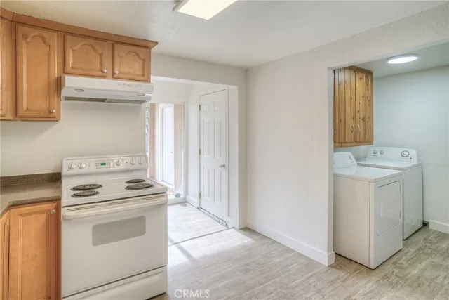 a kitchen with a stove and a microwave