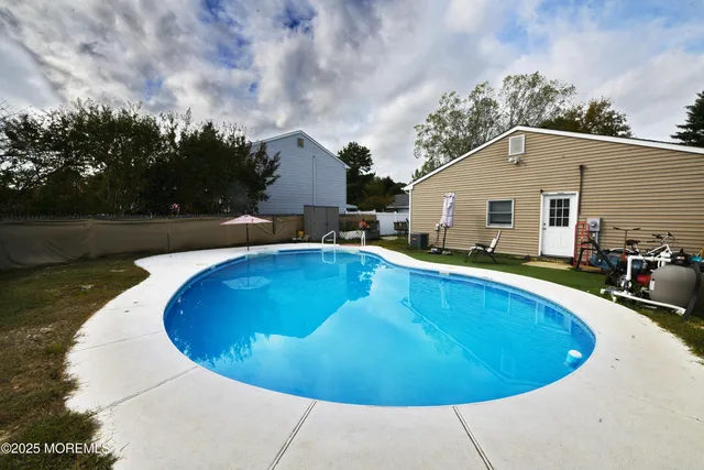 a view of a swimming pool with back yard