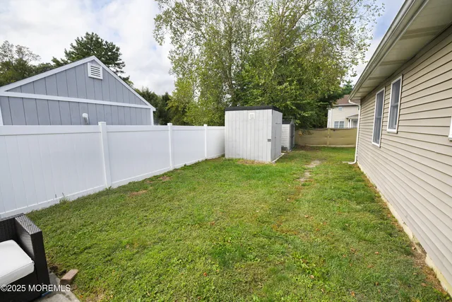 a view of a house with a yard and garage