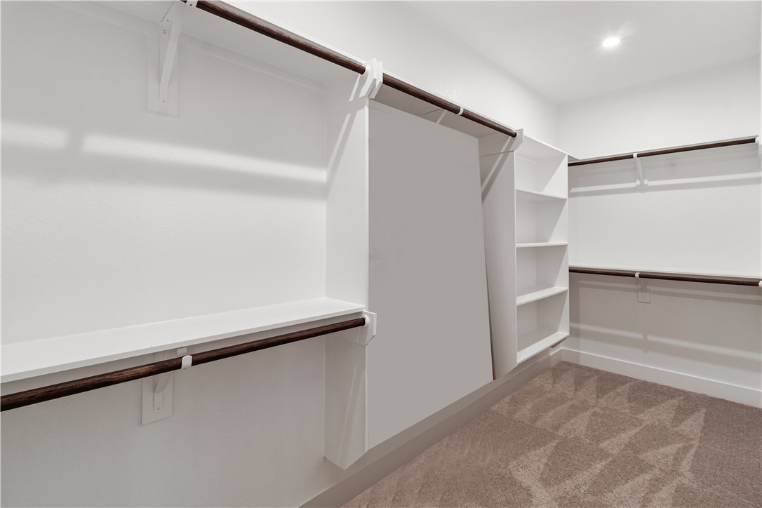 6303 Raleigh Drive College Station, TX 77845 - Photo 10 of 23 a view of walk in closet with empty racks