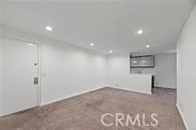 an empty room with a empty space and window