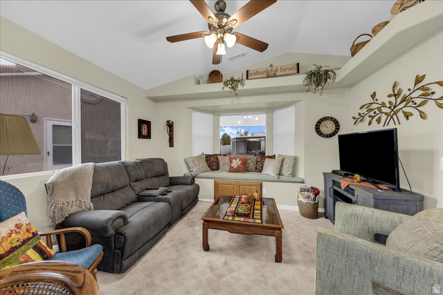2990 East Riverside Drive, Unit 166 St. George, UT 84790 - Photo 9 of 22 Carpeted living room featuring vaulted ceiling and ceiling fan