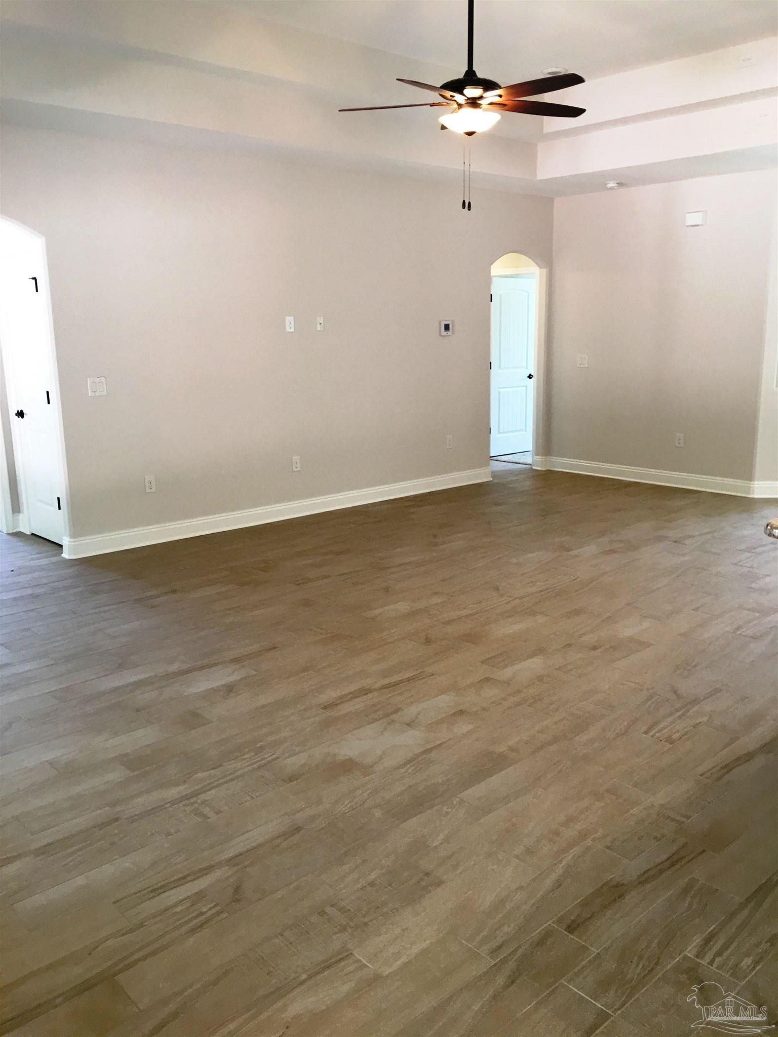 5336 South A Jones Road Milton, FL 32583 - Photo 3 of 33 Living room is open to dining/kitchen/nook.