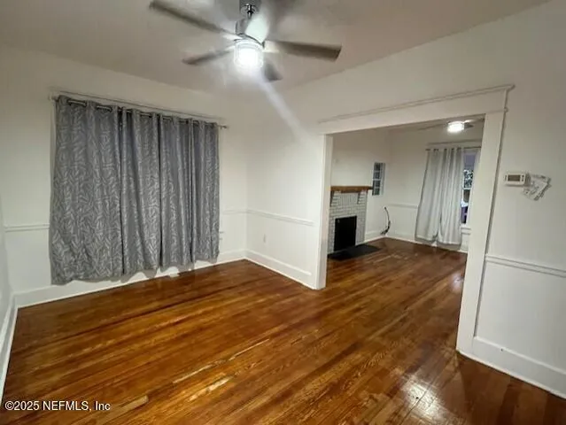 a view of livingroom with hardwood floor and a ceiling fan
