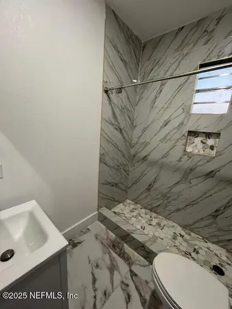 a bathroom with a sink and a toilet