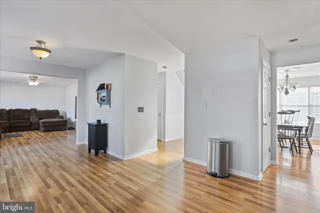 a view of kitchen with furniture and wooden floor