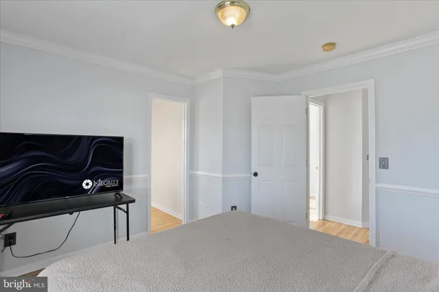 a view of a bedroom with furniture and closet