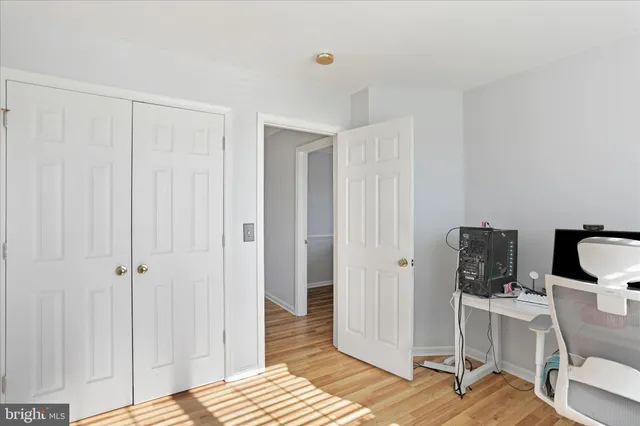 a view of a bedroom with a workspace