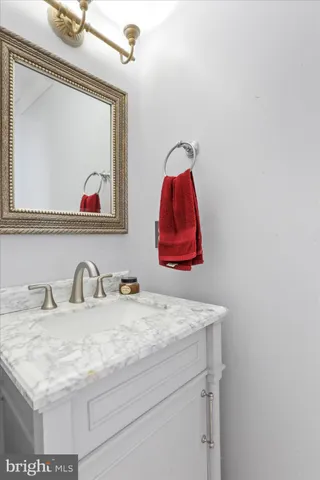 a room with a sink and a mirror