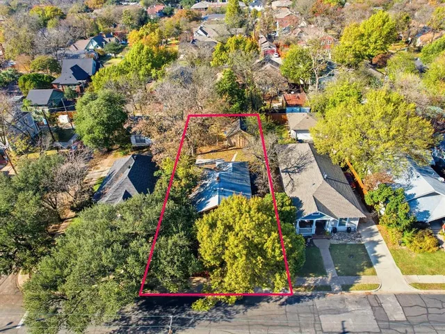 a front view of a house with parking area