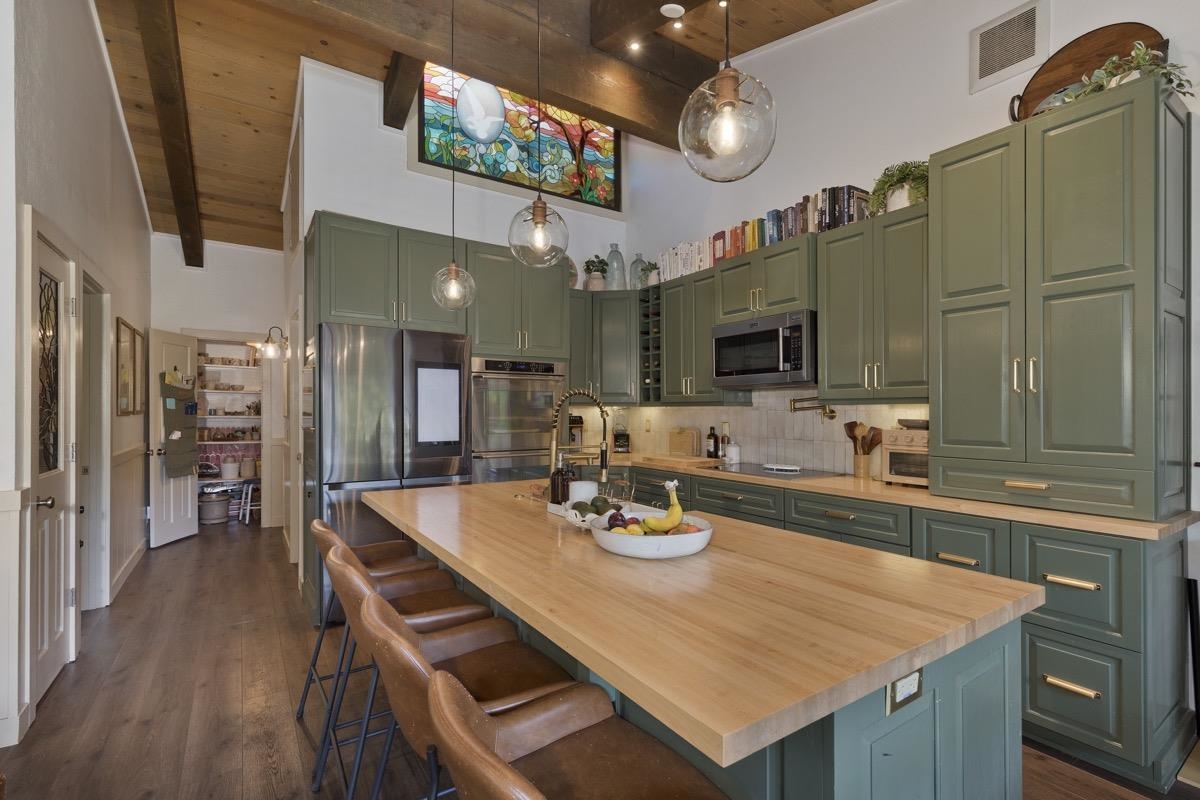 3251 Chateau Road, Unit 12 Mammoth Lakes, CA 93546 - Photo 24 of 50 a kitchen with a table chairs and wooden floor