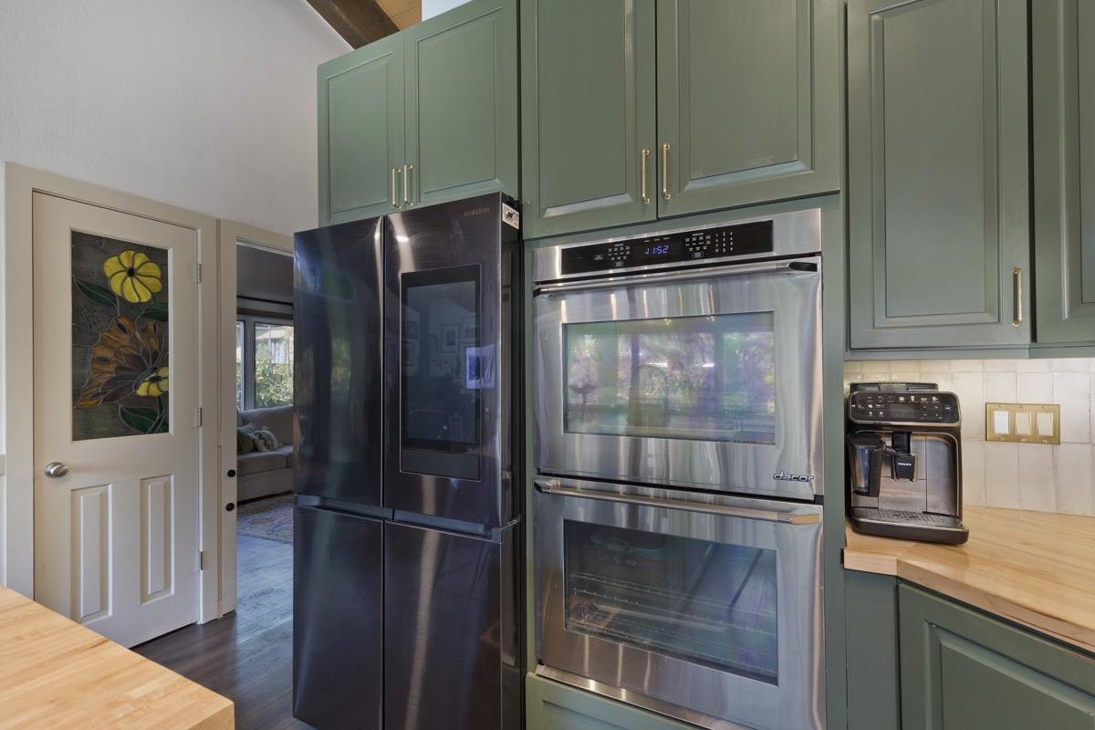 3251 Chateau Road, Unit 12 Mammoth Lakes, CA 93546 - Photo 26 of 50 a kitchen with granite countertop a refrigerator and a stove top oven