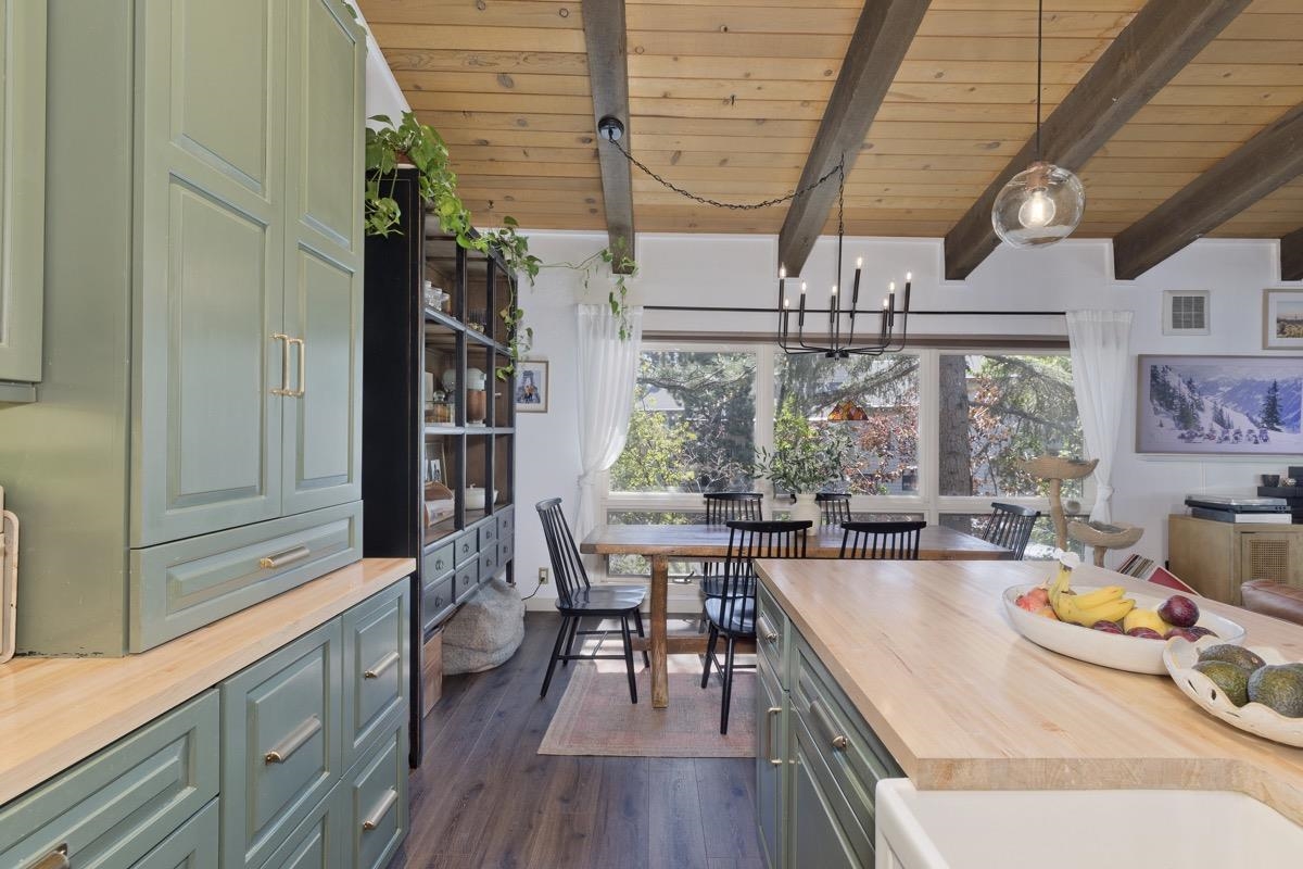 3251 Chateau Road, Unit 12 Mammoth Lakes, CA 93546 - Photo 27 of 50 a view of a dining room with furniture window and wooden floor
