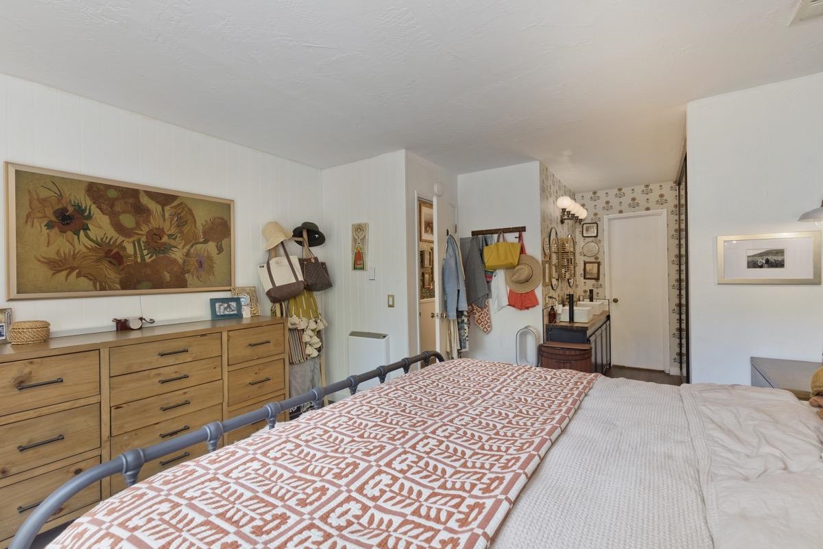 3251 Chateau Road, Unit 12 Mammoth Lakes, CA 93546 - Photo 28 of 50 a bedroom with a bed and a dresser in it