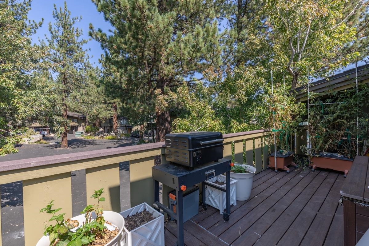 3251 Chateau Road, Unit 12 Mammoth Lakes, CA 93546 - Photo 35 of 50 a view of a deck with wooden floor and outdoor seating