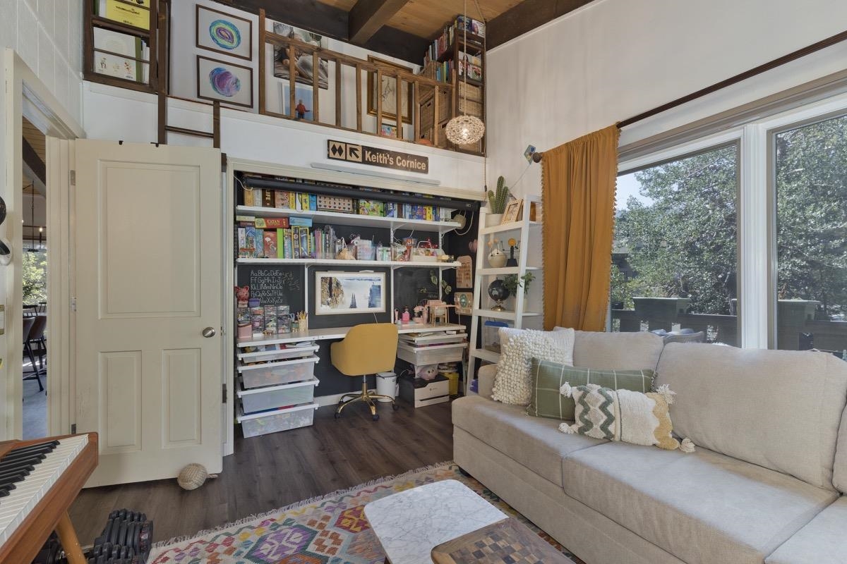 3251 Chateau Road, Unit 12 Mammoth Lakes, CA 93546 - Photo 7 of 50 a living room with furniture a rug toys and a window