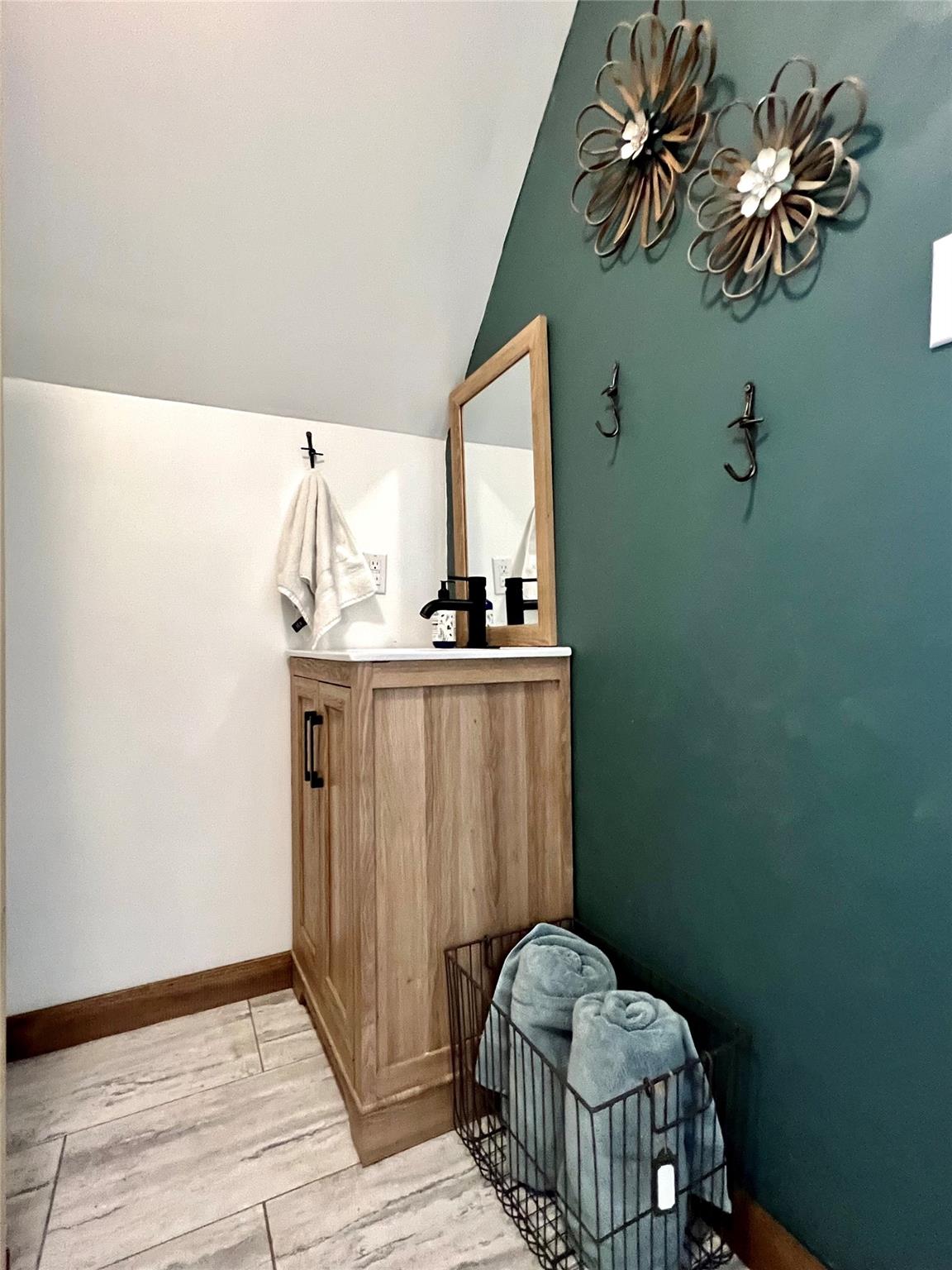3430 Rimer Road Concord, NC 28025 - Photo 27 of 32 a bathroom with a sink a mirror and a toilet