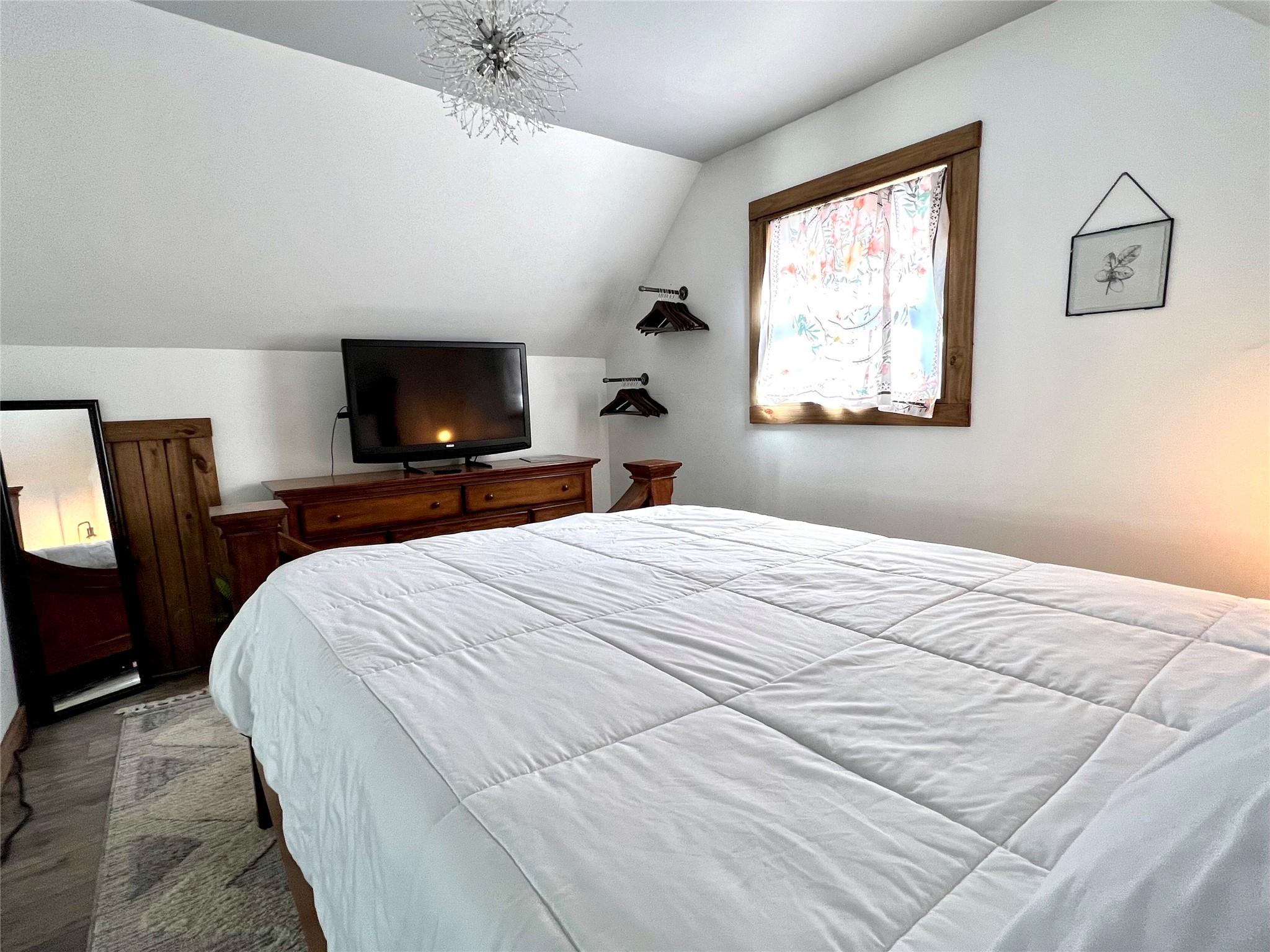 3430 Rimer Road Concord, NC 28025 - Photo 28 of 32 a bedroom with a bed and wooden floor