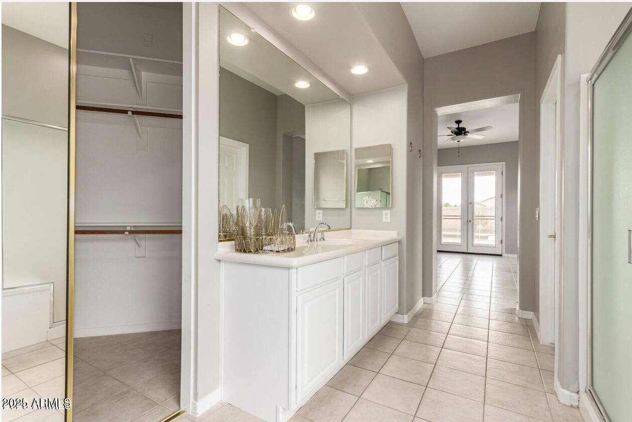 1515 North Los Alamos Circle Mesa, AZ 85213 - Photo 18 of 39 a bathroom with a double vanity sink and a mirror
