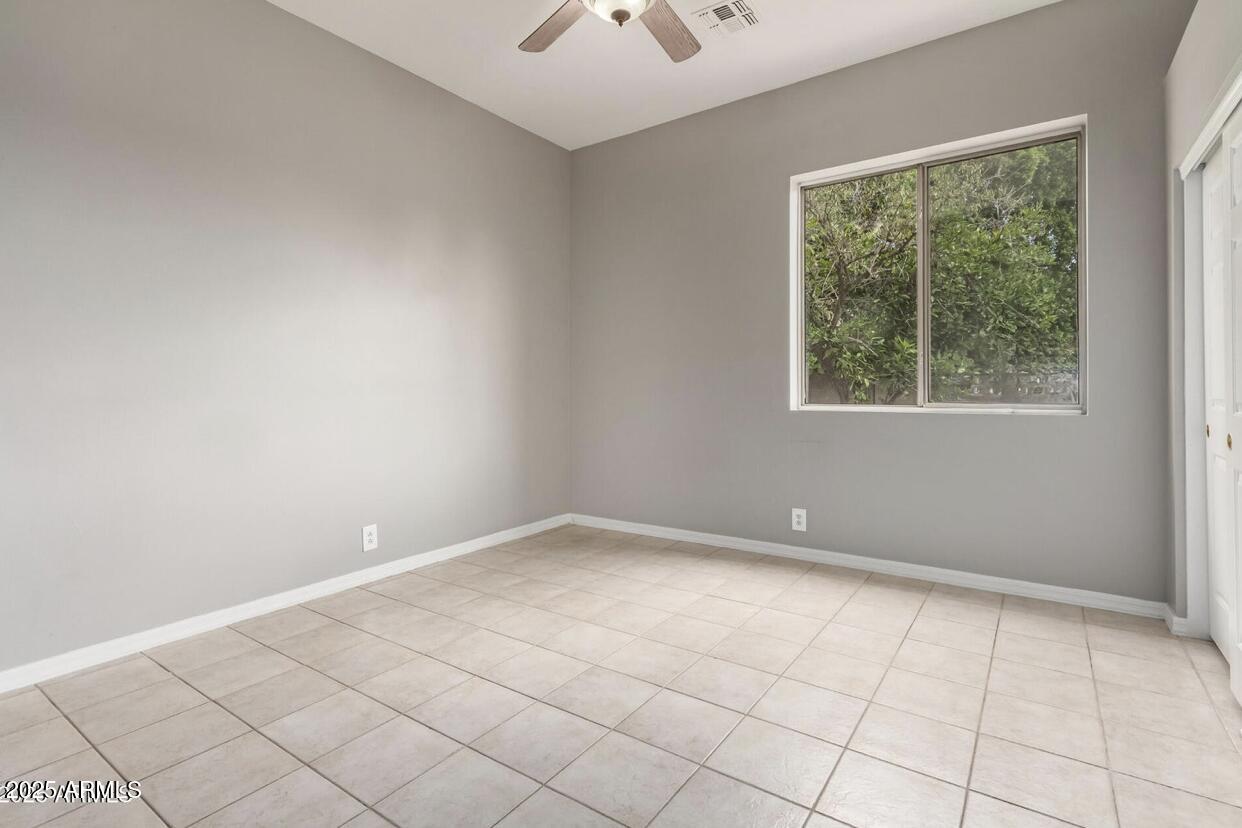 1515 North Los Alamos Circle Mesa, AZ 85213 - Photo 23 of 39 an empty room with windows