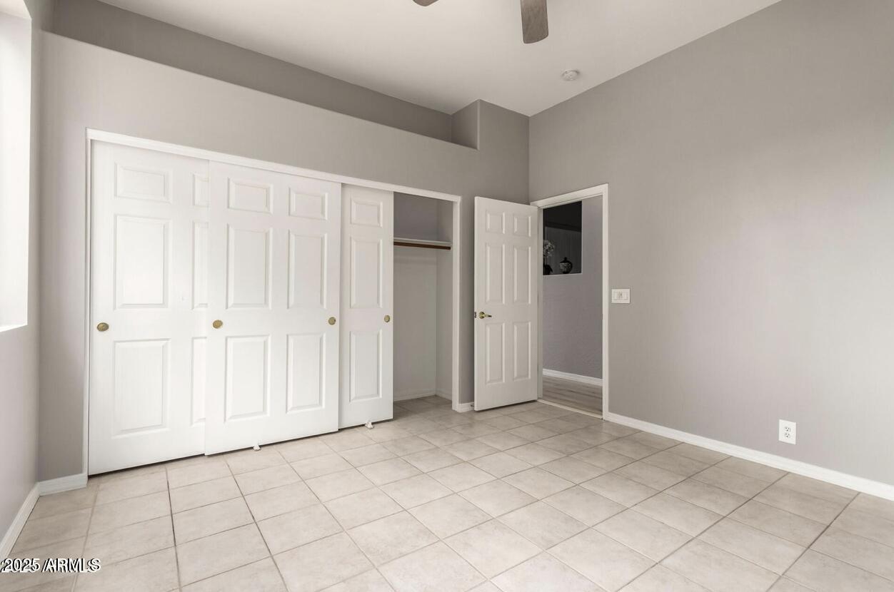 1515 North Los Alamos Circle Mesa, AZ 85213 - Photo 24 of 39 an empty room with windows