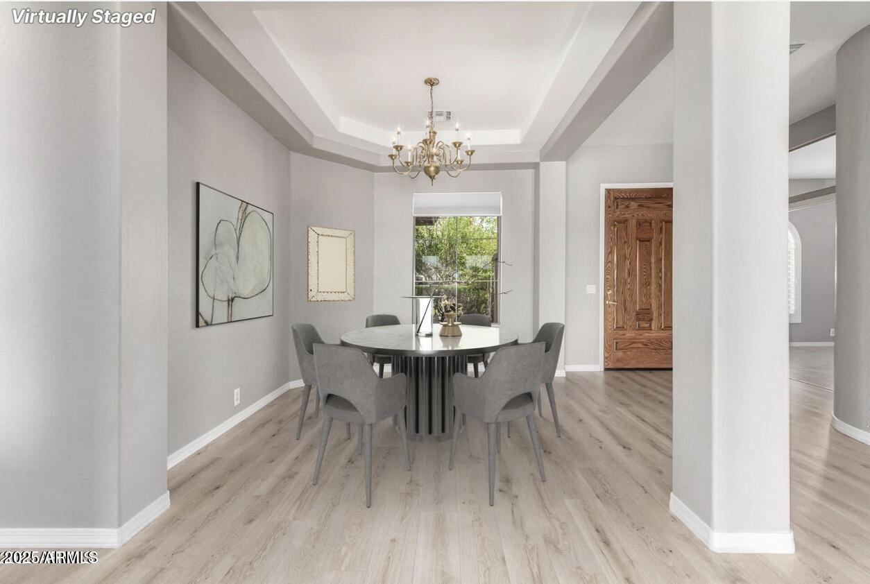 1515 North Los Alamos Circle Mesa, AZ 85213 - Photo 3 of 39 a view of a dining room with furniture window and wooden floor
