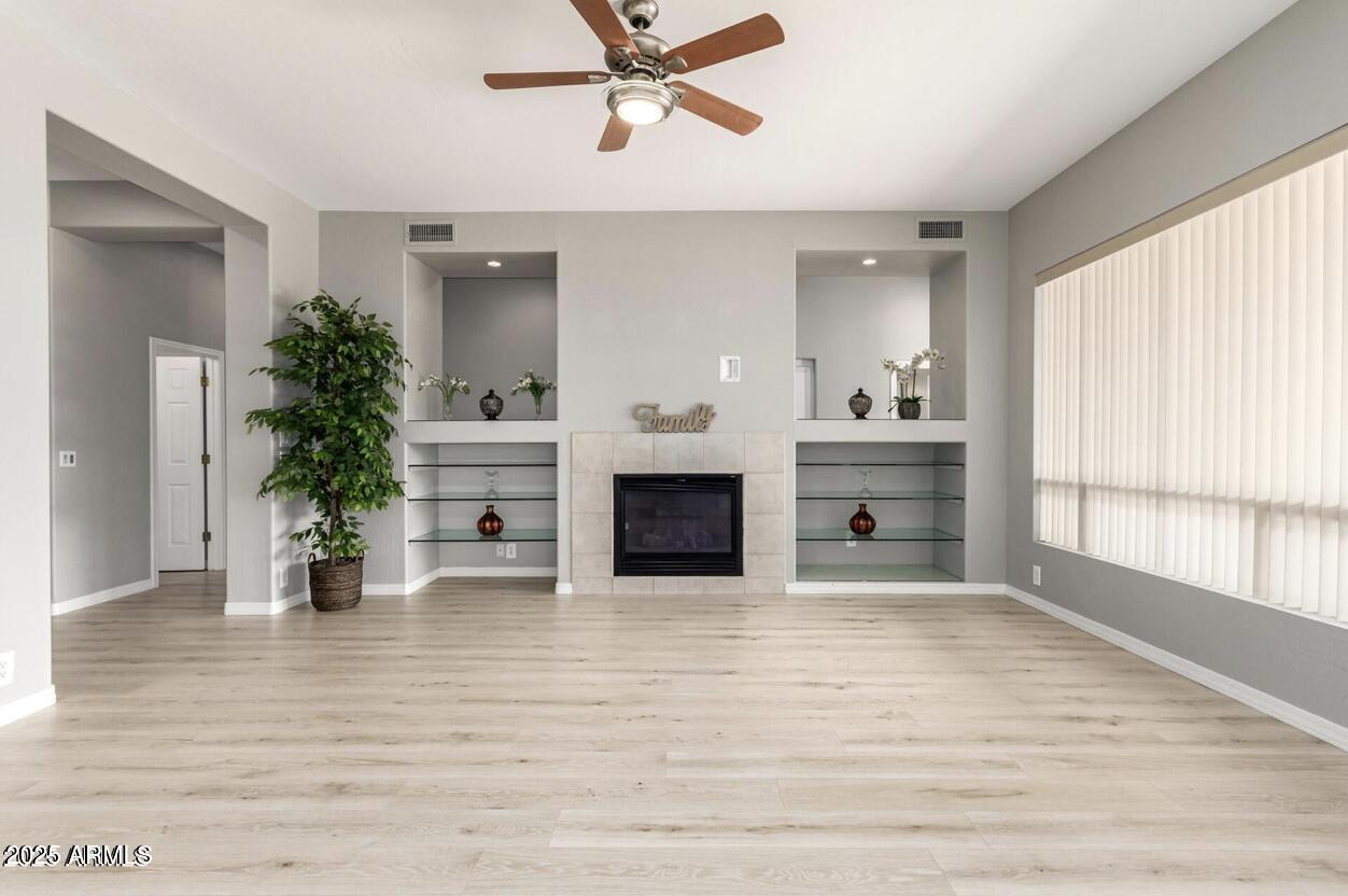 1515 North Los Alamos Circle Mesa, AZ 85213 - Photo 6 of 39 a view of a living room a window and a fireplace