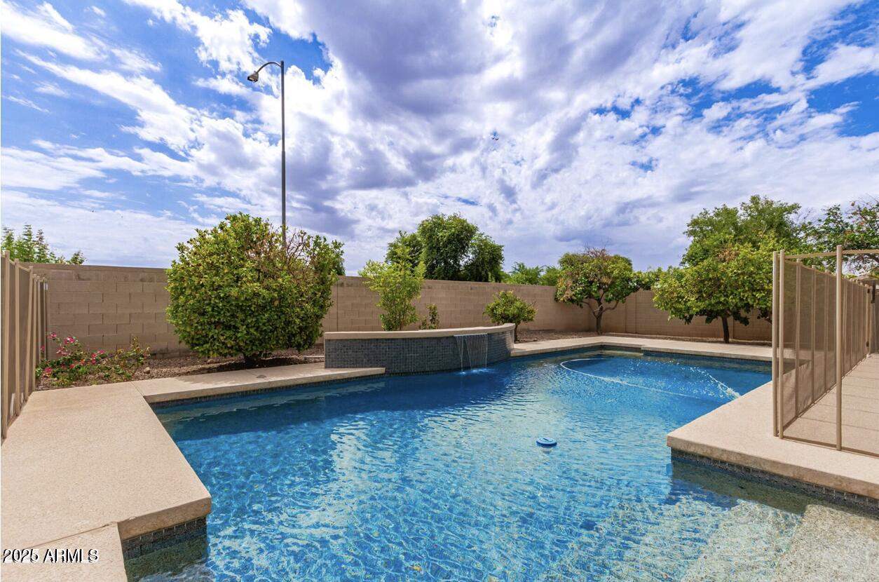 1515 North Los Alamos Circle Mesa, AZ 85213 - Photo 9 of 39 a view of a backyard with sitting area