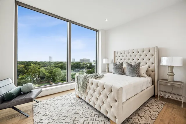 a view of a dining room with furniture and a kitchen view