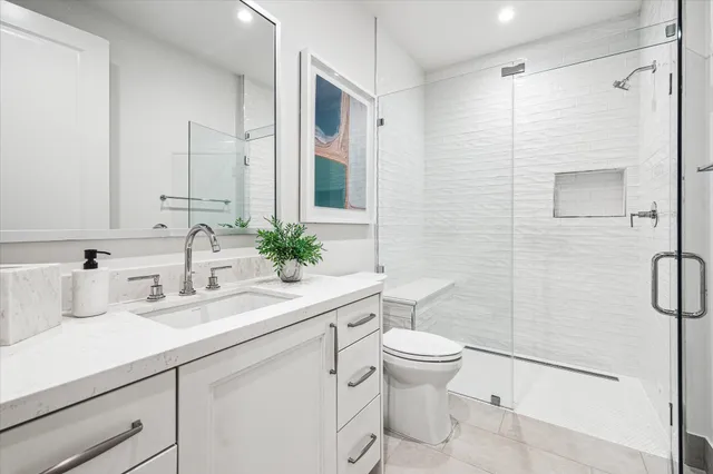 a view of a swimming pool with outdoor seating and a floor to ceiling window