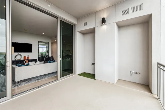 a bathroom with a double vanity sink a mirror and a bathtub