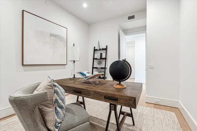 a bedroom with a large bed and a large window