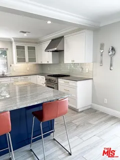 a utility room with sink dryer and washer