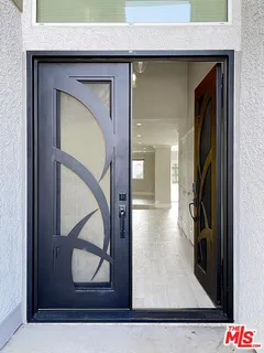 a view of hallway with wooden floor and stairs