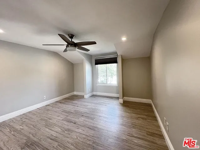 a view of a room that has a large window