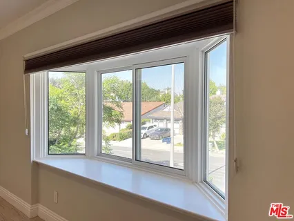 a large spacious bathroom with a double vanity sink mirror and bathtub