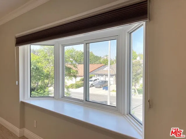 a large spacious bathroom with a double vanity sink mirror and bathtub