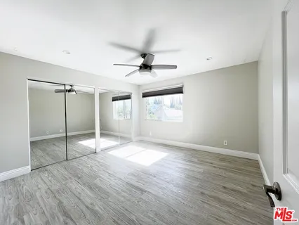 a view of a house with backyard and deck