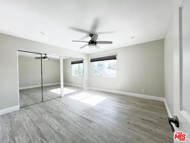 a view of a house with backyard and deck