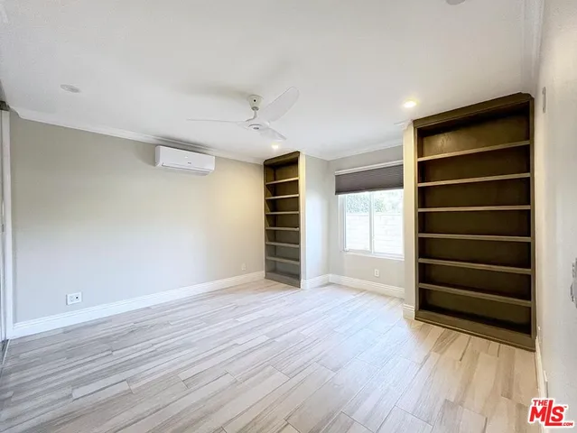 a bathroom with a sink a toilet a mirror and shower