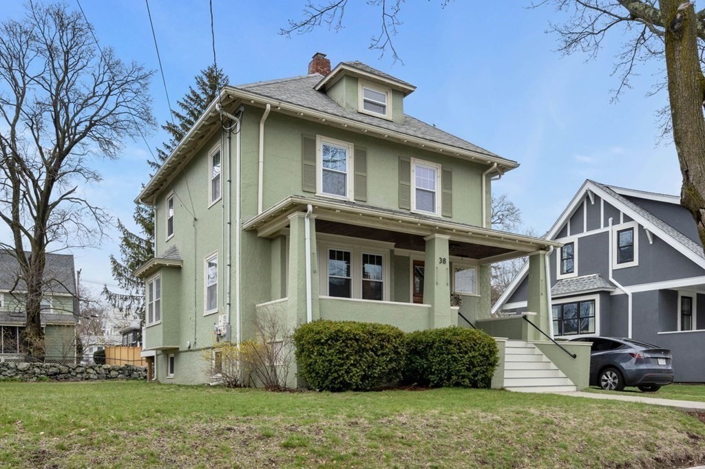 front view of a house with a yard