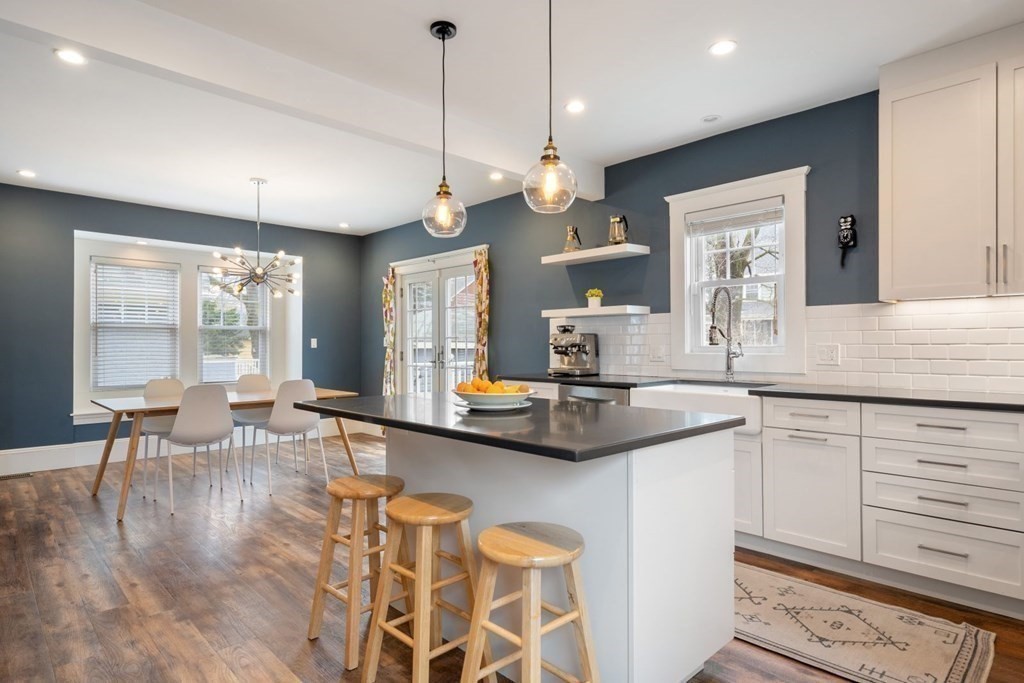 38 Jackson Road Medford, MA 02155 - Photo 12 of 42 a large kitchen with a table and chairs in it