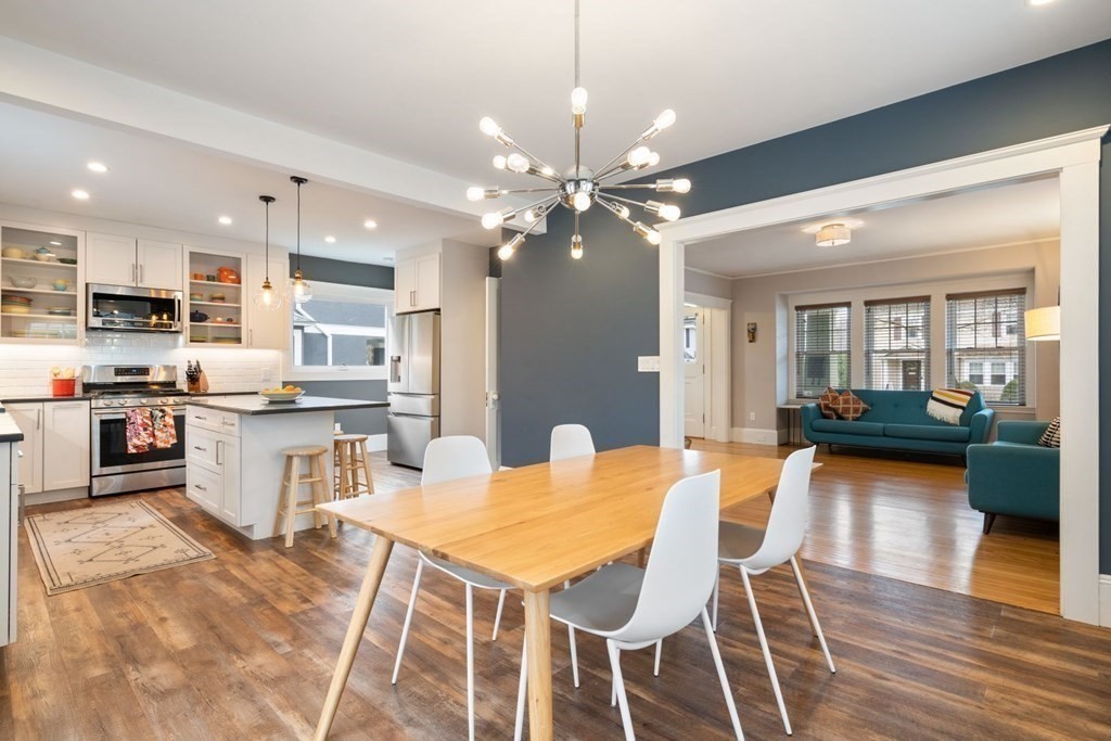 38 Jackson Road Medford, MA 02155 - Photo 2 of 42 a kitchen with stainless steel appliances kitchen island granite countertop a dining table chairs and sink
