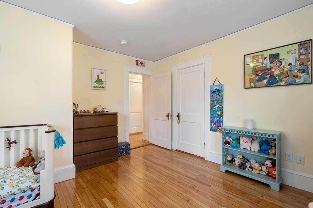38 Jackson Road Medford, MA 02155 - Photo 26 of 42 a room with furniture and wooden floor