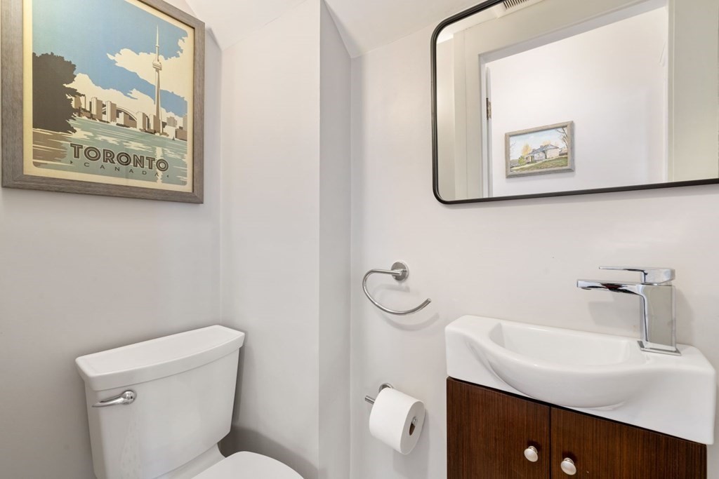 38 Jackson Road Medford, MA 02155 - Photo 29 of 42 a bathroom with a toilet sink and mirror