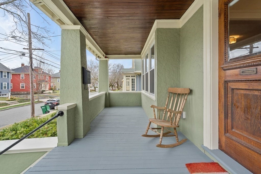 38 Jackson Road Medford, MA 02155 - Photo 35 of 42 a view of a porch with furniture and a yard