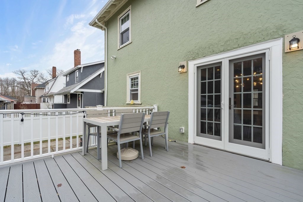38 Jackson Road Medford, MA 02155 - Photo 38 of 42 a dinning table and chairs in patio of house
