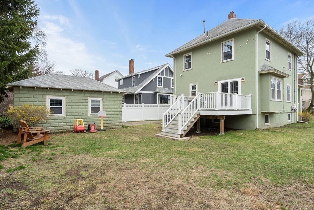 38 Jackson Road Medford, MA 02155 - Photo 5 of 42 a front view of a house with a yard